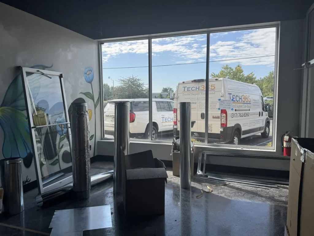 Technician installing structured cabling in a commercial environment