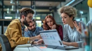 Small business team collaborating on proactive IT solutions in a modern office